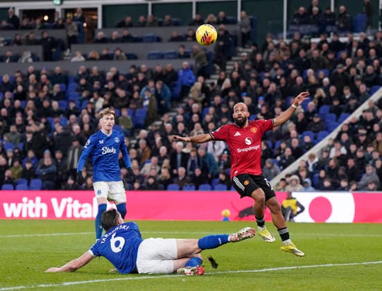 Liverpool, England, 23rd February 2026. James Tarkowski of Everton fails to stop the ball reaching Bryan Mbeumo of Manchester United, ManU during the Everton vs Manchester United Premier League match at Hill Dickinson Stadium, Liverpool. Picture credit should read: Andrew Yates Sportimage EDITORIAL USE ONLY. No use with unauthorised audio, video, data, fixture lists, club league logos or live services. Online in-match use limited to 120 images, no video emulation. No use in betting, games or single club league player publications. SPI_036_AY_Everton_Man_Utd SPI-4547-0035