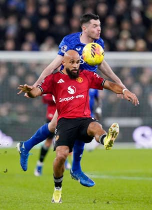 Liverpool, England, 23rd February 2026. James Tarkowski of Everton challenges Bryan Mbeumo of Manchester United, ManU during the Everton vs Manchester United Premier League match at Hill Dickinson Stadium, Liverpool. Picture credit should read: Andrew Yates Sportimage EDITORIAL USE ONLY. No use with unauthorised audio, video, data, fixture lists, club league logos or live services. Online in-match use limited to 120 images, no video emulation. No use in betting, games or single club league player publications. SPI_039_AY_Everton_Man_Utd SPI-4547-0039