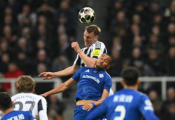 Dan Burn for Newcastle United vies for the ball with Dani Bolt of Qarabag Newcastle United v Qarabag, UEFA Champions League, Knockout Round Play-Offs, Second Leg, Football, St James Park, Newcastle, UK - 24 Feb 2026Newcastle St James Park Azerbaijan EDITORIAL USE ONLY No use with unauthorised audio, video, data, fixture lists, club league logos or live services. Online in-match use limited to 120 images, no video emulation. No use in betting, games or single club league player publications. Copyright: xRichardxLee Shutterstockx 16693044aw
