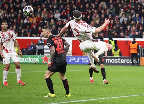 v.l. Mehdi Taremi (Olympiakos Piraeus 99), Alejandro Grimaldo (Bayer Leverkusen, 20), Lorenzo Pirola (Olympiakos Piraeus 05) GER, Bayer 04 Leverkusen vs. Olympiakos Piraeus, Fussball, Champions League, Play-offs, Rueckspiel, Spielzeit 2025 2026, 24.02.2026 GER, Bayer 04 Leverkusen vs. Olympiakos Piraeus, Fussball, Champions League, Play-offs, Rueckspiel, Spielzeit 2025 2026, 24.02.2026 Leverkusen Copyright: xEibner-Pressefotox xThomasxStoecx EP_TSR