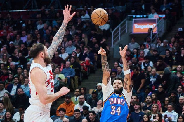 February 24, 2026, Toronto, On, Canada: Oklahoma City Thunder s Kenrich Williams (34) shoots past Toronto Raptors Sandro Mamukelashvili (54) during first half NBA, Basketball Herren, USA basketball action in Toronto, on Tuesday, Feb. 24, 2026. Canada News - February 24, 2026 - ZUMAc35_ 20260224_zaf_c35_098 Copyright: xSammyxKoganx