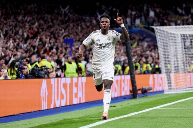 Vinicius Jr of Real Madrid CF celebrates after scoring a goal Real Madrid v Benfica, UEFA Champions League, Play-off, Leg 2, Football, Estadio Bernabeu, Madrid, Spain - 25 Feb 2026Madrid Estadio Bernabeu Spain EDITORIAL USE ONLY No use with unauthorised audio, video, data, fixture lists, club league logos or live services. Online in-match use limited to 120 images, no video emulation. No use in betting, games or single club league player publications. Copyright: xRubenxAlbarran Shutterstockx 16703182ch