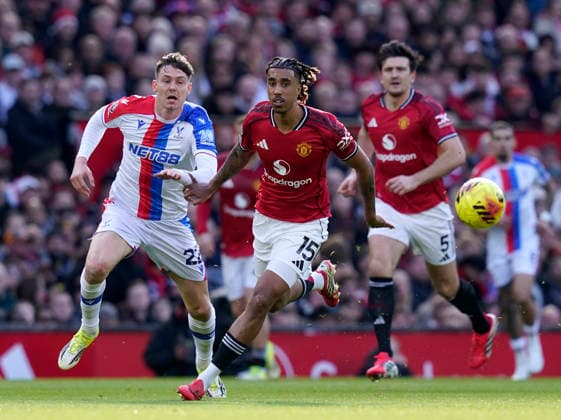 Manchester, England, 1st March 2026. Jorge Strand Larsen of Crystal Palace and Leny Yoro of Manchester United, ManU during the Manchester United vs Crystal Palace Premier League match at Old Trafford, Manchester. Picture credit should read: Andrew Yates Sportimage EDITORIAL USE ONLY. No use with unauthorised audio, video, data, fixture lists, club league logos or live services. Online in-match use limited to 120 images, no video emulation. No use in betting, games or single club league player publications. SPI_029_AY_Man_Utd_Palace SPI-4566-0029