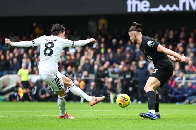 Harry Wilson of Fulham with a shot on goal under pressure from Radu Dragusin of Tottenham Hotspur Fulham v Tottenham Hotspur, Premier League, Football, Craven Cottage, London, UK - 01 Mar 2026London Craven Cottage United Kingdom EDITORIAL USE ONLY No use with unauthorised audio, video, data, fixture lists, club league logos or live services. Online in-match use limited to 120 images, no video emulation. No use in betting, games or single club league player publications. Copyright: xSimonxDael Shutterstockx 16708827bk