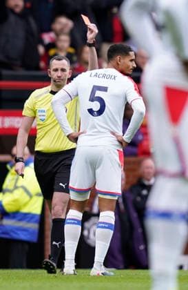 Manchester, England, 1st March 2026. Maxence Lacroix of Crystal Palace is shown the red card during the Manchester United, ManU vs Crystal Palace Premier League match at Old Trafford, Manchester. Picture credit should read: Andrew Yates Sportimage EDITORIAL USE ONLY. No use with unauthorised audio, video, data, fixture lists, club league logos or live services. Online in-match use limited to 120 images, no video emulation. No use in betting, games or single club league player publications. SPI_039_AY_Man_Utd_Palace SPI-4566-0039