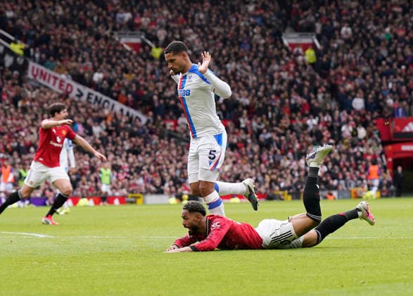 Manchester, England, 1st March 2026. Maxence Lacroix of Crystal Palace brings down Matheus Cunha of Manchester United, ManU to give a way a penalty and get sent off during the Manchester United vs Crystal Palace Premier League match at Old Trafford, Manchester. Picture credit should read: Andrew Yates Sportimage EDITORIAL USE ONLY. No use with unauthorised audio, video, data, fixture lists, club league logos or live services. Online in-match use limited to 120 images, no video emulation. No use in betting, games or single club league player publications. SPI_066_AY_Man_Utd_Palace SPI-4566-0067