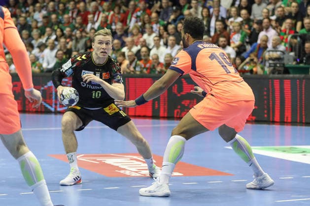 05.03.2026, xgox, Handball - EHF Champions League SC Magdeburg - FC Barcelona, Barca v.l. Gisli Thorgeir Kristjansson (Magdeburg, 10), Timothey N guessan (N guessan, Barcelona, 19) Zweikampf, Duell, Kampf, tackle Magdeburg