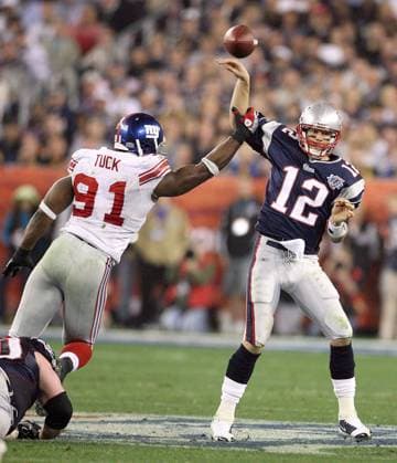 Feb. 3, 2008 - New England Patriots quarterback Tom Brady gets a pass away under the pressure of the New York Giants Justin Tuck (91) in the second half of Super Bowl XLII at University of Phoenix Stadium in Glendale, Arizona, on Sunday, February 3, 2008. (Gary W. Green MCT) Copyright: xGaryxW.xGreenx