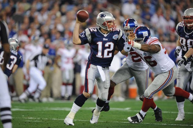 Feb 03, 2008 - Glendale, Arizona, USA - New England Patriots quarterback TOM BRADY is pressured by BARRY COFIELD of the New York Giants during the first quarter of Super Bowl XLII at University of Phoenix Stadium. The New England Patriots who went unbeaten during their 2007 season faced the New York Giants. Copyright: xKarlxMondonx