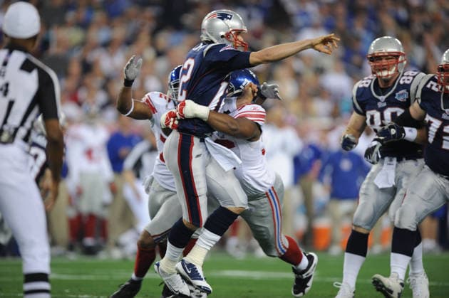 Feb 03, 2008 - Glendale, Arizona, USA - New England Patriots quarterback TOM BRADY pressured by BARRY COFIELD of the New York Giants during the first quarter of Super Bowl XLII at University of Phoenix Stadium. The New England Patriots who went unbeaten during their 2007 season faced the New York Giants. Copyright: xKarlxMondonx