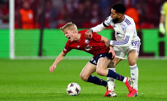 Hakon Arnar Haraldsson of Lille and Douglas Luiz of Aston Villa. Lille v Aston Villa, UEFA Europa League, Round of 16, First Leg, Football, Stade Pierre-Mauroy, Lille, France - 12 Mar 2026Lille Stade Pierre-Mauroy France EDITORIAL USE ONLY No use with unauthorised audio, video, data, fixture lists, club league logos or live services. Online in-match use limited to 120 images, no video emulation. No use in betting, games or single club league player publications. Copyright: xJamesxMarsh Shutterstockx 16746748am