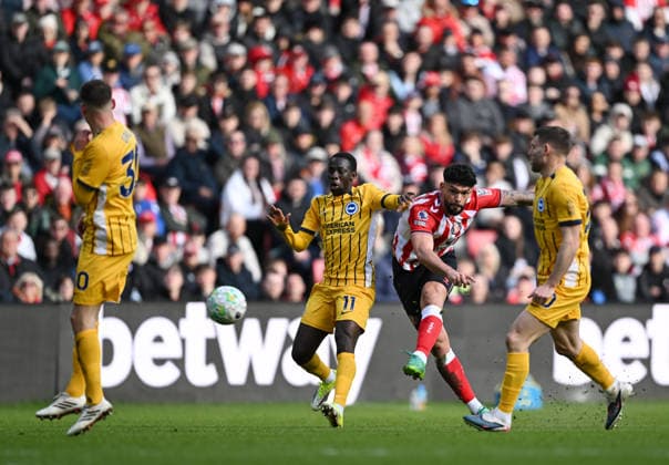 Omar Alderete of Sunderland shoots at goal as Yankuba Minteh of Brighton & Hove Albion tackles Sunderland v Brighton and Hove Albion, Premier League, Football, Stadium of Light, Sunderland, UK - 14 Mar 2026Sunderland Stadium of Light United Kingdom EDITORIAL USE ONLY No use with unauthorised audio, video, data, fixture lists, club league logos or live services. Online in-match use limited to 120 images, no video emulation. No use in betting, games or single club league player publications. Copyright: xGreigxCowie Shutterstockx 16757170ag