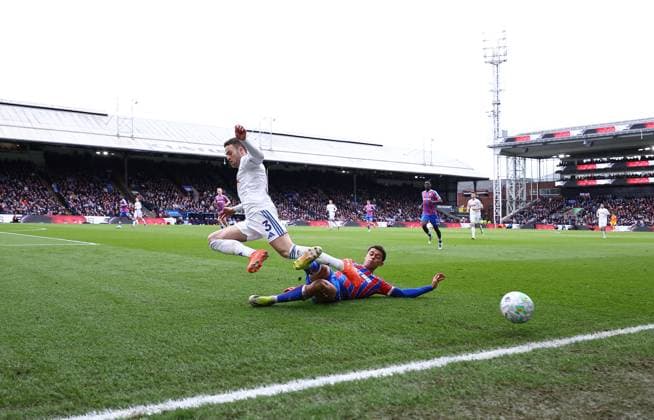 Brennan Johnson of Crystal Palace tacles Gabriel Gudmundsson of Leeds United Crystal Palace v Leeds United, Premier League, Football, Selhurst Park, London, UK - 15 Mar 2026London Selhurst Park United Kingdom EDITORIAL USE ONLY No use with unauthorised audio, video, data, fixture lists, club league logos or live services. Online in-match use limited to 120 images, no video emulation. No use in betting, games or single club league player publications. Copyright: xMichaelxZemanek Shutterstockx 16757310o