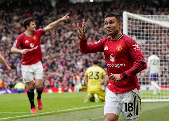 Manchester, England, 15th March 2026. Casemiro of Manchester United, ManU celebrates scoring the first goal during the Manchester United vs Aston Villa Premier League match at Old Trafford, Manchester. Picture credit should read: Andrew Yates Sportimage EDITORIAL USE ONLY. No use with unauthorised audio, video, data, fixture lists, club league logos or live services. Online in-match use limited to 120 images, no video emulation. No use in betting, games or single club league player publications. SPI_055_AY_Man_Utd_Villa SPI-4605-0055