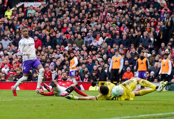 Manchester, England, 15th March 2026. Matheus Cunha of Manchester United, ManU soores the second goal during the Manchester United vs Aston Villa Premier League match at Old Trafford, Manchester. Picture credit should read: Andrew Yates Sportimage EDITORIAL USE ONLY. No use with unauthorised audio, video, data, fixture lists, club league logos or live services. Online in-match use limited to 120 images, no video emulation. No use in betting, games or single club league player publications. SPI_061_AY_Man_Utd_Villa SPI-4605-0061