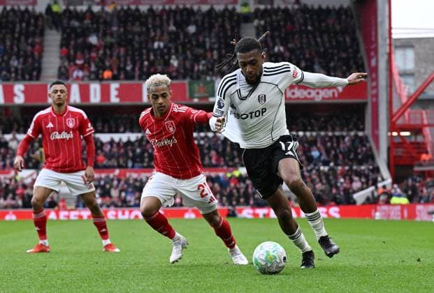 Omari Hutchinson of Nottingham Forest and Alex Iwobi of Fulham Nottingham Forest v Fulham, Premier League, Football, City Ground, Nottingham, UK - 15 Mar 2026Nottingham City Ground United Kingdom EDITORIAL USE ONLY No use with unauthorised audio, video, data, fixture lists, club league logos or live services. Online in-match use limited to 120 images, no video emulation. No use in betting, games or single club league player publications. Copyright: xAnnaxGowthorpe Shutterstockx 16757313aw