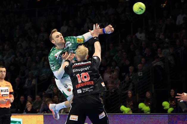 DEU, DHB, 1.HBL, Fuechse Berlin vs.Erlangen, 15.03.2026, Max-Schmeling-Halle, Berlin, DEU, DHB, 1.HBL, Fuechse Berlin vs.Erlangen, im Bild Mathias Gidsel (Fuechse Berlin 19), Sebastian Firnhaber (Erlangen 18)