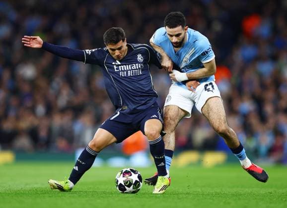 Rayan Ait-Nouri of Manchester City and Brahim Diaz of Real Madrid Manchester City v Real Madrid, UEFA Champions League, Round of 16, Second Leg, Football, Etihad Stadium, Manchester, UK - 17 Mar 2026Manchester Etihad Stadium United Kingdom EDITORIAL USE ONLY No use with unauthorised audio, video, data, fixture lists, club league logos or live services. Online in-match use limited to 120 images, no video emulation. No use in betting, games or single club league player publications. Copyright: xMattxWest Shutterstockx 16776379af