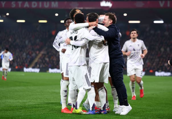 Bournemouth, England, 20th March 2026. A pitch invader joins in the celebrations as Bruno Fernandes of Manchester United, ManU celebrates with team mates after scoring to make it 1-0 during the AFC Bournemouth vs Manchester United Premier League match at the Vitality Stadium, Bournemouth. Picture credit should read: Paul Terry Sportimage EDITORIAL USE ONLY. No use with unauthorised audio, video, data, fixture lists, club league logos or live services. Online in-match use limited to 120 images, no video emulation. No use in betting, games or single club league player publications. SPI_071_PT_Bournemouth_Man_Utd SPI-4628-0071