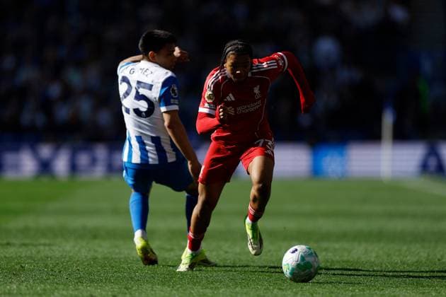 Rio Ngumoha of Liverpool is challenged by Diego Gomez of Brighton and Hove Albion Brighton and Hove Albion v Liverpool, Premier League, Football, American Express Community Stadium, Brighton, UK - 21 Mar 2026Brighton American Express Community Stadi United Kingdom EDITORIAL USE ONLY No use with unauthorised audio, video, data, fixture lists, club league logos or live services. Online in-match use limited to 120 images, no video emulation. No use in betting, games or single club league player publications. Copyright: xWillxCooper Shutterstockx 16783233am