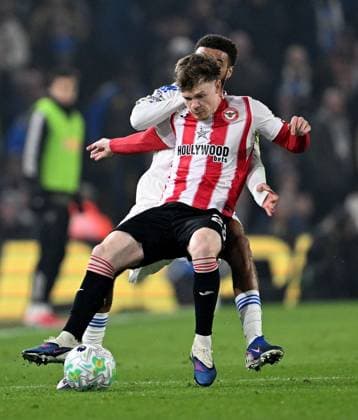 Keane Lewis-Potter of Brentford and Jayden Bogle of Leeds United Leeds v Brentford, Premier League, Football, Elland Road, Leeds, UK - 21 Mar 2026Leeds Elland Road United Kingdom EDITORIAL USE ONLY No use with unauthorised audio, video, data, fixture lists, club league logos or live services. Online in-match use limited to 120 images, no video emulation. No use in betting, games or single club league player publications. Copyright: xAnnaxGowthorpe Shutterstockx 16783311z
