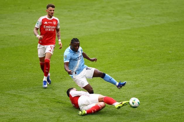William Saliba of Arsenal tackles Jà rà my Doku of Manchester City Arsenal v Manchester City, EFL Carabao Cup, Final, Football, Wembley Stadium, London, UK - 22 Mar 2026London Wembley Stadium United Kingdom EDITORIAL USE ONLY No use with unauthorised audio, video, data, fixture lists, club league logos or live services. Online in-match use limited to 120 images, no video emulation. No use in betting, games or single club league player publications. Copyright: xJamesxMarsh Shutterstockx 16783338mf