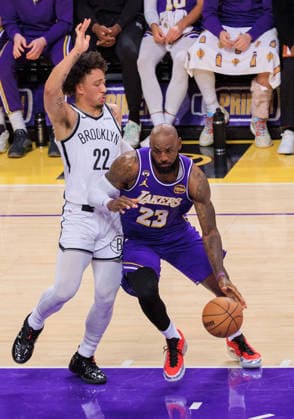 March 27, 2026, Los Angeles, California, USA: LeBron James 23 of the Los Angeles Lakers drives against Danny Wolf 2 of the Brooklyn Nets during a regular season NBA, Basketball Herren, USA game on Friday March 27, 2026 at Crypto.com Arena in Los Angeles, California. Lakers defeat Nets, 116-99. JAVIER ROJAS PI Lakers Defeat Nets, 116-99 - ZUMAp124 20260327_zaa_p124_062 Copyright: xJavierxRojasx