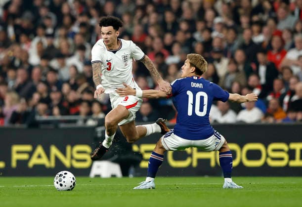 London, England, 31st March 2026. Nico O Reilly of England skips past Ritsu Doan of Japan during the England vs Japan International Friendly, Länderspiel, Nationalmannschaft match at Wembley Stadium, London. Picture credit should read: Matthew Impey Sportimage EDITORIAL USE ONLY. No use with unauthorised audio, video, data, fixture lists, club league logos or live services. Online in-match use limited to 120 images, no video emulation. No use in betting, games or single club league player publications. SPI_026_MI_Eng_Japan SPI-4662-0025