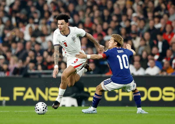 London, England, 31st March 2026. Nico O Reilly of England skips past Ritsu Doan of Japan during the England vs Japan International Friendly, Länderspiel, Nationalmannschaft match at Wembley Stadium, London. Picture credit should read: Matthew Impey Sportimage EDITORIAL USE ONLY. No use with unauthorised audio, video, data, fixture lists, club league logos or live services. Online in-match use limited to 120 images, no video emulation. No use in betting, games or single club league player publications. SPI_027_MI_Eng_Japan SPI-4662-0026