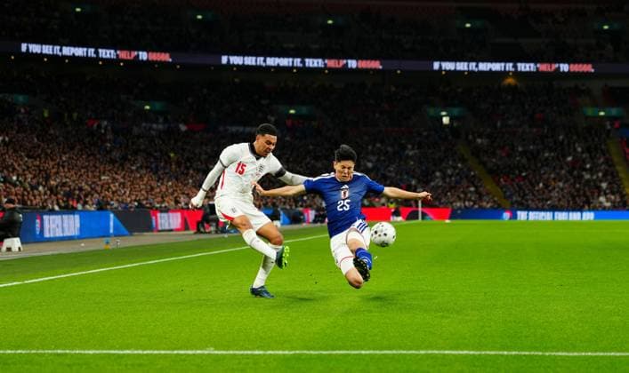 Morgan Rogers of England crosses under pressure from Junnosuke Suzuki of Japan England v Japan, International Football, Friendly, Football, Wembley Stadium, London, UK - 31 Mar 2026London Wembley Stadium United Kingdom EDITORIAL USE ONLY No use with unauthorised audio, video, data, fixture lists, club league logos or live services. Online in-match use limited to 120 images, no video emulation. No use in betting, games or single club league player publications. Copyright: xJavierxGarcia Shutterstockx 16808984bw
