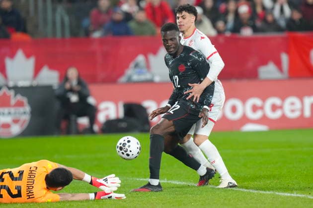 March 31, 2026, Toronto, On, CAN: Canada s Tani Oluwaseyi, centre, fails to score as he battles with Tunisia s Alaa Ghram as goalkeeper Abdelmouhib Chamakh tries to gather the ball during second half International Friendly, Länderspiel, Nationalmannschaft action in Toronto, on Tuesday March 31, 2026. Tani Oluwaseyi; Alaa Ghram; Abdelmouhib Chamakh - ZUMAc35_ 20260331_zaf_c35_128 Copyright: xChrisxYoungx