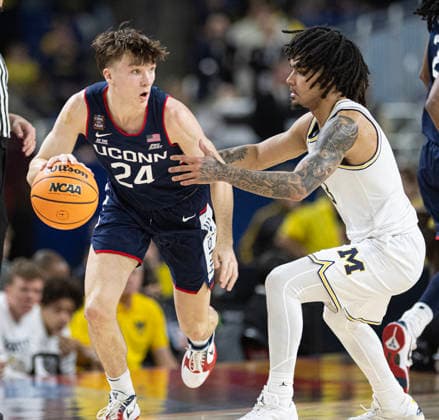 April 6, 2026, Indianapolis, Indiana, USA: UConn freshman and Greenfield-Central graduate Braylon Mullins, left, drives past Michigans Elliott Cadeau during first half action of the NCAA, College League, USA Mens Basketball Championship. Michigan went on to win 69-63. Monday, April 7, 2026. Indiana Sports - April 6, 2026 - ZUMAr44_ 20260406_zsp_r44_009 Copyright: xThomasxJ.xRussox