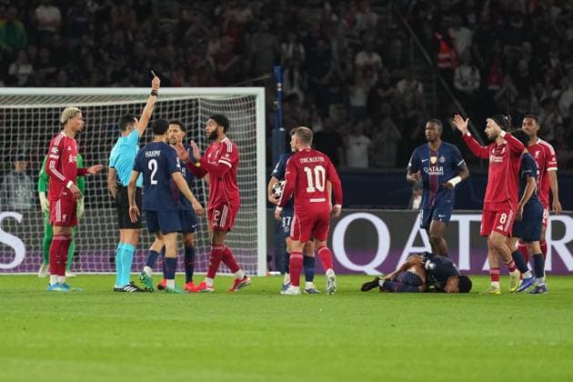 Joe Gomez of Liverpool receives a yellow card for a foul on Desire Doue of PSG Paris Saint-Germain v Liverpool, UEFA Champions League, Quarter Final, First Leg, Football, Parc des Princes, Paris, France - 08 Apr 2026Paris Parc des Princes France EDITORIAL USE ONLY No use with unauthorised audio, video, data, fixture lists, club league logos or live services. Online in-match use limited to 120 images, no video emulation. No use in betting, games or single club league player publications. Copyright: xDavexWinter Shutterstockx 16811861be