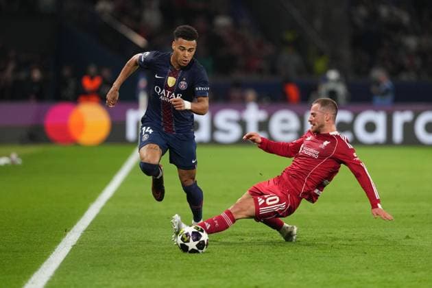 Alexis Mac Allister of Liverpool receives a yellow card for a foul on Desire Doue of PSG Paris Saint-Germain v Liverpool, UEFA Champions League, Quarter Final, First Leg, Football, Parc des Princes, Paris, France - 08 Apr 2026Paris Parc des Princes France EDITORIAL USE ONLY No use with unauthorised audio, video, data, fixture lists, club league logos or live services. Online in-match use limited to 120 images, no video emulation. No use in betting, games or single club league player publications. Copyright: xDavexWinter Shutterstockx 16811861bg