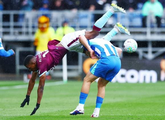 Florentino Luis of Burnley and Jack Hinshelwood of Brighton & Hove Albion Burnley v Brighton and Hove Albion, Premier League, Football, Turf Moor, Burnley, UK - 11 Apr 2026Burnley Turf Moor United Kingdom EDITORIAL USE ONLY No use with unauthorised audio, video, data, fixture lists, club league logos or live services. Online in-match use limited to 120 images, no video emulation. No use in betting, games or single club league player publications. Copyright: xMattxWest Shutterstockx 16823549p