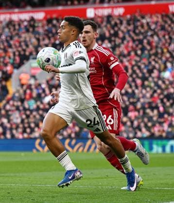 Joshua King of Fulham and Andrew Robertson of Liverpool Liverpool v Fulham, Premier League, Football, Anfield, Liverpool, UK - 11 Apr 2026Liverpool Anfield United Kingdom EDITORIAL USE ONLY No use with unauthorised audio, video, data, fixture lists, club league logos or live services. Online in-match use limited to 120 images, no video emulation. No use in betting, games or single club league player publications. Copyright: xAnnaxGowthorpe Shutterstockx 16823590aq