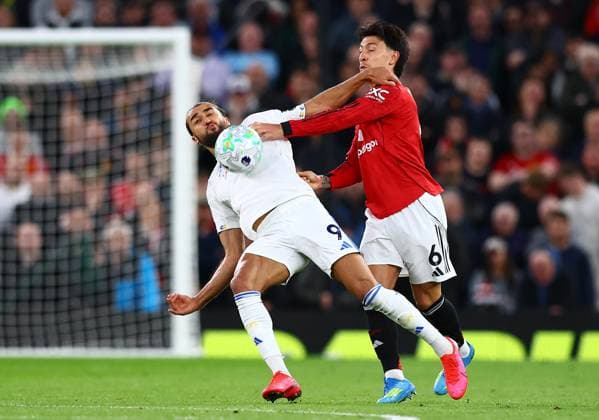 Dominic Calvert-Lewin of Leeds United and Lisandro Martinez of Manchester United, ManU Manchester United v Leeds United, Premier League, Football, Old Trafford, Manchester, UK - 13 Apr 2026Manchester Old Trafford United Kingdom EDITORIAL USE ONLY No use with unauthorised audio, video, data, fixture lists, club league logos or live services. Online in-match use limited to 120 images, no video emulation. No use in betting, games or single club league player publications. Copyright: xMattxWest Shutterstockx 16827177p