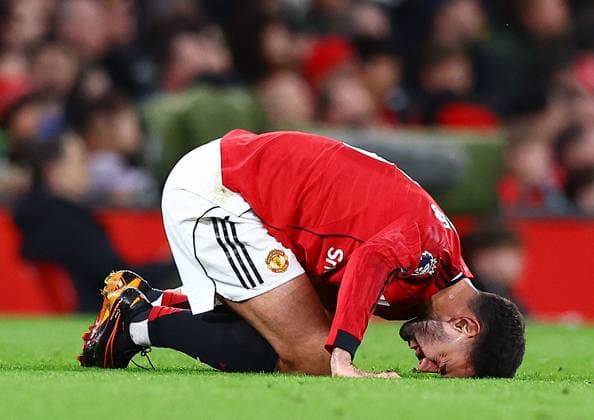 Bruno Fernandes of Manchester United, ManU appears to be injured as Leeds United score their second goal 0-2 Manchester United v Leeds United, Premier League, Football, Old Trafford, Manchester, UK - 13 Apr 2026Manchester Old Trafford United Kingdom EDITORIAL USE ONLY No use with unauthorised audio, video, data, fixture lists, club league logos or live services. Online in-match use limited to 120 images, no video emulation. No use in betting, games or single club league player publications. Copyright: xMattxWest Shutterstockx 16827177v