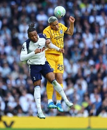 Diego Gomez of Brighton & Hove Albion competes for the ball with Destiny Udogie of Tottenham Hotspur Tottenham Hotspur v Brighton and Hove Albion, Premier League, Football, Tottenham Hotspur Stadium, London, UK - 18 Apr 2026London Tottenham Hotspur Stadium United Kingdom EDITORIAL USE ONLY No use with unauthorised audio, video, data, fixture lists, club league logos or live services. Online in-match use limited to 120 images, no video emulation. No use in betting, games or single club league player publications. Copyright: xMichaelxZemanek Shutterstockx 16832172o