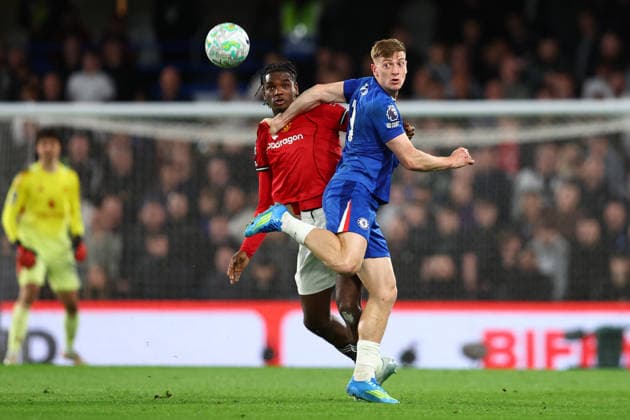 London, England, 18th April 2026. Ayden Heaven of Manchester United, ManU and Liam Delap of Chelsea challenge for the ball during the Chelsea vs Manchester United Premier League match at Stamford Bridge, London. Picture credit should read: Paul Terry Sportimage EDITORIAL USE ONLY. No use with unauthorised audio, video, data, fixture lists, club league logos or live services. Online in-match use limited to 120 images, no video emulation. No use in betting, games or single club league player publications. SPI_034_PT_Chelsea_Man_Utd SPI-4701-0034