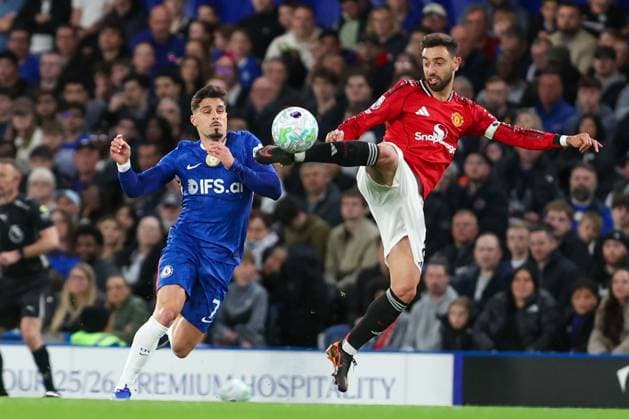 Bruno Fernandes of Manchester United, ManU kicks the ball whilst under pressure from Pedro Neto of Chelsea Chelsea v Manchester United, Football, Premier League, Stamford Bridge, London, UK - 18 04 2026 EDITORIAL USE ONLY No use with unauthorised audio, video, data, fixture lists, club league logos or live services. Online in-match use limited to 120 images, no video emulation. No use in betting, games or single club league player publications. Copyright: xAnthonyxHanc Shutterstockx 16835348at