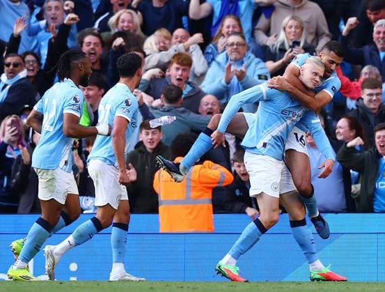 Erling Haaland of Manchester City celebrates scoring a goal to make it 1-2 with their team-mates Manchester City v Arsenal, Premier League, Football, Etihad Stadium, Manchester, UK - 19 Apr 2026Manchester Etihad Stadium United Kingdom EDITORIAL USE ONLY No use with unauthorised audio, video, data, fixture lists, club league logos or live services. Online in-match use limited to 120 images, no video emulation. No use in betting, games or single club league player publications. Copyright: xMattxWest Shutterstockx 16836204bn