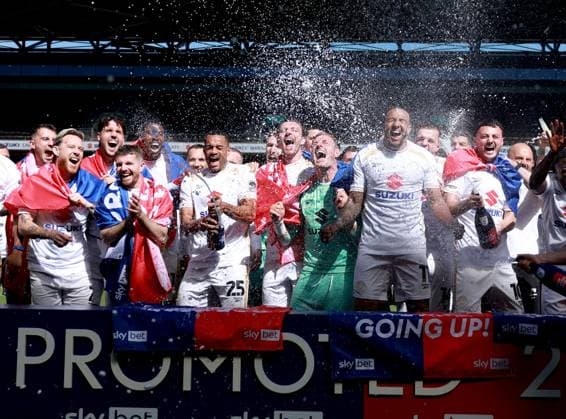 Milton Keynes Dons players celebrate their side s promotion to EFL League One Milton Keynes Dons v Tranmere Rovers, EFL Sky Bet League Two, Football, Stadium MK, Milton Keynes, UK - 25 Apr 2026Milton Keynes Stadium MK United Kingdom EDITORIAL USE ONLY No use with unauthorised audio, video, data, fixture lists, club league logos or live services. Online in-match use limited to 120 images, no video emulation. No use in betting, games or single club league player publications. Copyright: xGeorgexTewkesbury Shutterstockx 16838787bp