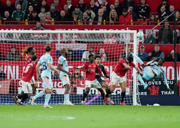 Manchester, England, 27th April 2026. Dango Ouattara of Brentford fouls Harry Maguire of Manchester United, ManU during the Manchester United vs Brentford Premier League match at Old Trafford, Manchester. Picture credit should read: Andrew Yates Sportimage EDITORIAL USE ONLY. No use with unauthorised audio, video, data, fixture lists, club league logos or live services. Online in-match use limited to 120 images, no video emulation. No use in betting, games or single club league player publications. SPI_054_AY_MANCHESTER_UNITED_V_BRENTFORD SPI-4740-0054