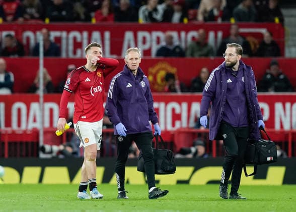 Manchester, England, 27th April 2026. Luke Shaw of Manchester United, ManU leaves the pitch with an injury during the Manchester United vs Brentford Premier League match at Old Trafford, Manchester. Picture credit should read: Andrew Yates Sportimage EDITORIAL USE ONLY. No use with unauthorised audio, video, data, fixture lists, club league logos or live services. Online in-match use limited to 120 images, no video emulation. No use in betting, games or single club league player publications. SPI_055_AY_MANCHESTER_UNITED_V_BRENTFORD SPI-4740-0055