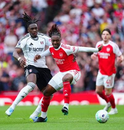 Calvin Bassey of Fulham battles with Eberechi Eze of Arsenal Arsenal v Fulham, Premier League, Football, Emirates Stadium, London , UK - 02 May 2026London Emirates Stadium United Kingdom EDITORIAL USE ONLY No use with unauthorised audio, video, data, fixture lists, club league logos or live services. Online in-match use limited to 120 images, no video emulation. No use in betting, games or single club league player publications. Copyright: xJavierxGarcia Shutterstockx 16854566ac