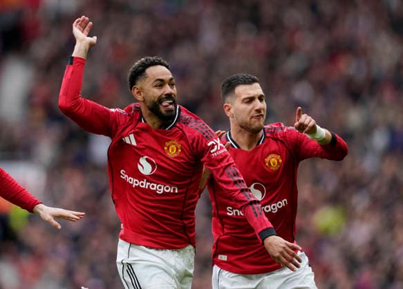 Manchester, England, 3rd May 2026. Matheus Cunha of Manchester United, ManU celebrates scoring the first goal during the Manchester United vs Liverpool Premier League match at Old Trafford, Manchester. Picture credit should read: Andrew Yates Sportimage EDITORIAL USE ONLY. No use with unauthorised audio, video, data, fixture lists, club league logos or live services. Online in-match use limited to 120 images, no video emulation. No use in betting, games or single club league player publications. SPI_024_AY_MAN_UTD_LIVERPOOL SPI-4776-0024