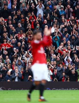 Manchester United, ManU fans applaud behind Bruno Fernandes Manchester United v Liverpool, Premier League, Football, Old Trafford, Manchester , UK - 03 May 2026Manchester Old Trafford United Kingdom EDITORIAL USE ONLY No use with unauthorised audio, video, data, fixture lists, club league logos or live services. Online in-match use limited to 120 images, no video emulation. No use in betting, games or single club league player publications. Copyright: xMattxWest Shutterstockx 16854589ax