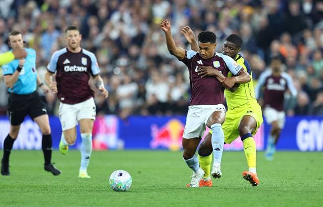 Ollie Watkins of Aston Villa competes for the ball with Kevin Danso of Tottenham Hotspur Aston Villa v Tottenham Hotspur, Premier League, Football, Villa Park, Birmingham , UK - 03 May 2026Birmingham Villa Park United Kingdom EDITORIAL USE ONLY No use with unauthorised audio, video, data, fixture lists, club league logos or live services. Online in-match use limited to 120 images, no video emulation. No use in betting, games or single club league player publications. Copyright: xMichaelxZemanek Shutterstockx 16854596bl