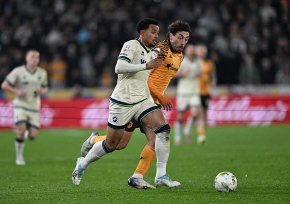 Femi Azeez of Millwall and Matt Crooks of Hull City Hull City v Millwall, EFL Sky Bet Championship, Play-Off Semi Final, First Leg, Football, MKM Stadium, Hull, UK - 08 May 2026Hull MKM Stadium United Kingdom EDITORIAL USE ONLY No use with unauthorised audio, video, data, fixture lists, club league logos or live services. Online in-match use limited to 120 images, no video emulation. No use in betting, games or single club league player publications. Copyright: xAnnaxGowthorpe Shutterstockx 16861584ad